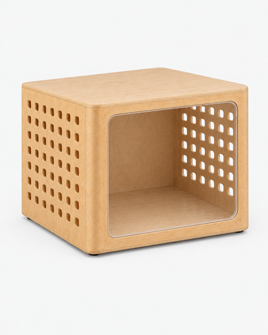 Three-quarter view of the natural oak crate from the left with the door removed, showing the flat table top, the open doorway and the full grid of airflow cut-outs on the side panel.